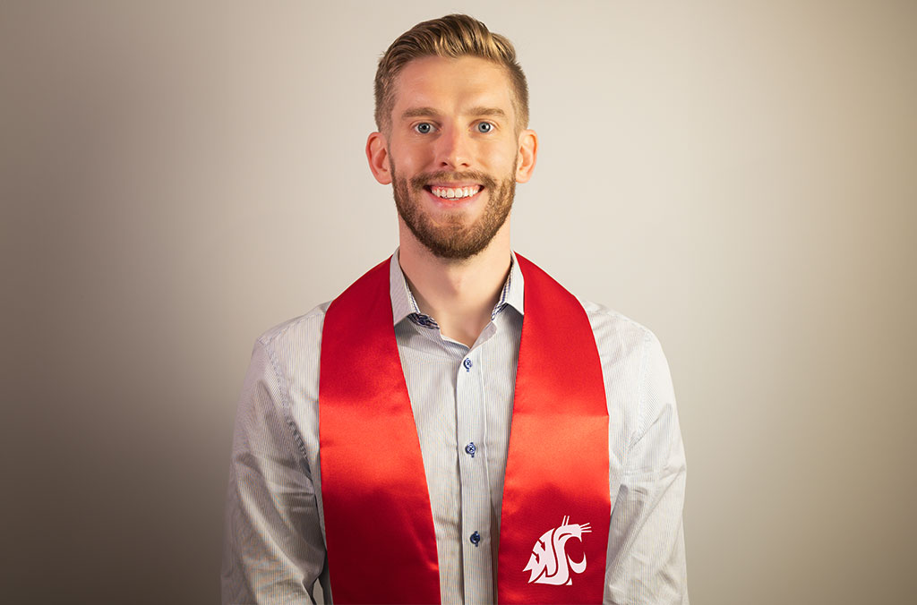 Headshot of Jeff Browne wearing crimson graduation stole.
