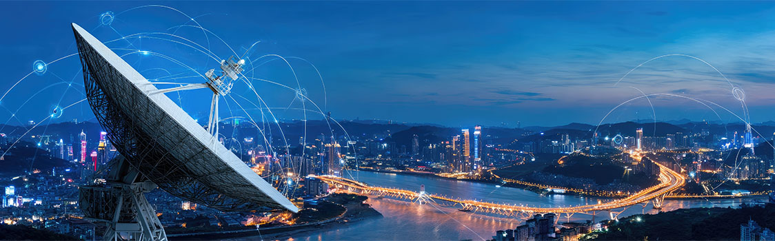 Large satellite dish overlooking a city skyline at dusk, with illuminated bridges and digital network lines representing global communication and connectivity.