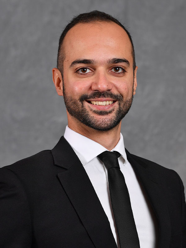 Headshot of Amirhossein Moadab.