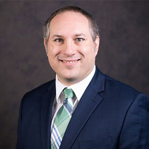 Headshot of Colin White.