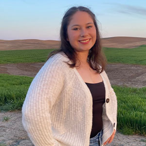 Headshot of Olivia Grose.