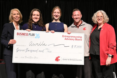 Team Arvella poses with a $7,000 third-place award check at the Business Plan Competition.