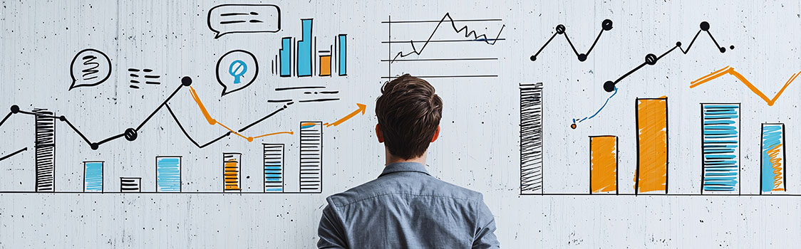 Person studies hand-drawn charts, graphs, and business metrics displayed across a wall-sized data visualization.
