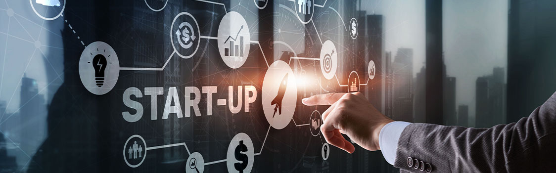Hand points to a digital startup diagram with connected icons for growth, finance, strategy, and innovation.