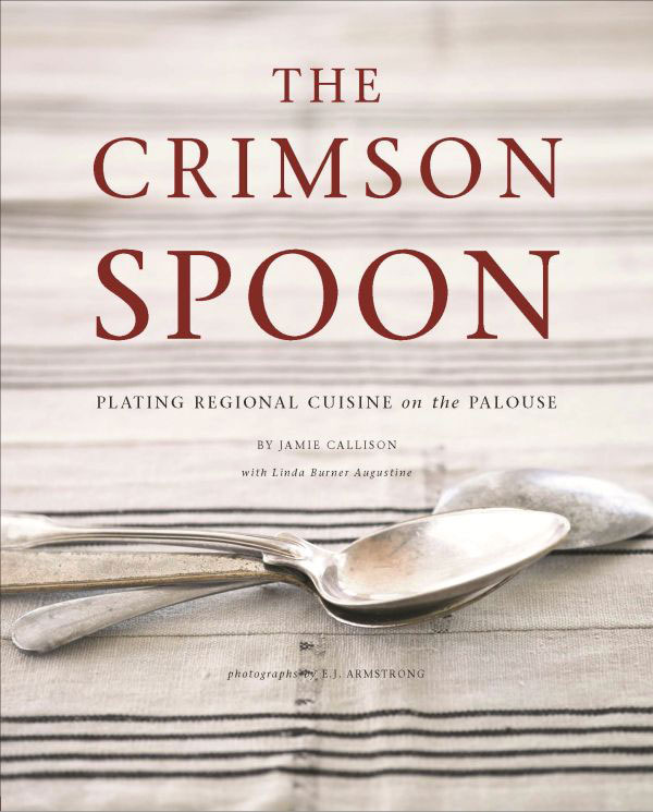 Book cover titled The Crimson Spoon: Plating Regional Cuisine on the Palouse, showing stacked silver spoons resting on a striped linen background.