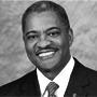 Grayscale headshot of Elson Floyd.