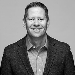 Grayscale headshot of Dan Spaulding.