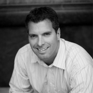 Grayscale headshot of Darren Alger.