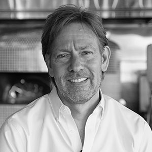 Grayscale headshot of Joe Fugere.