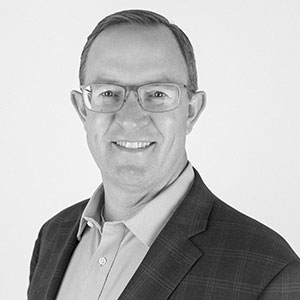 Grayscale headshot of Jeffrey Laub.