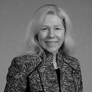 Grayscale headshot of Kathy Blomquist.