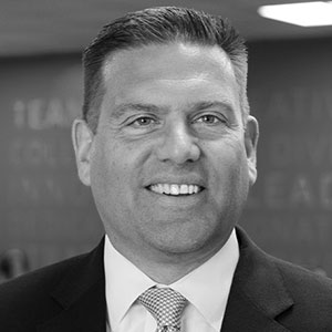 Grayscale headshot of Brad Johnson.