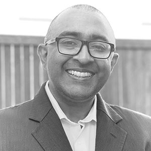 Grayscale headshot of Gautham Rao.