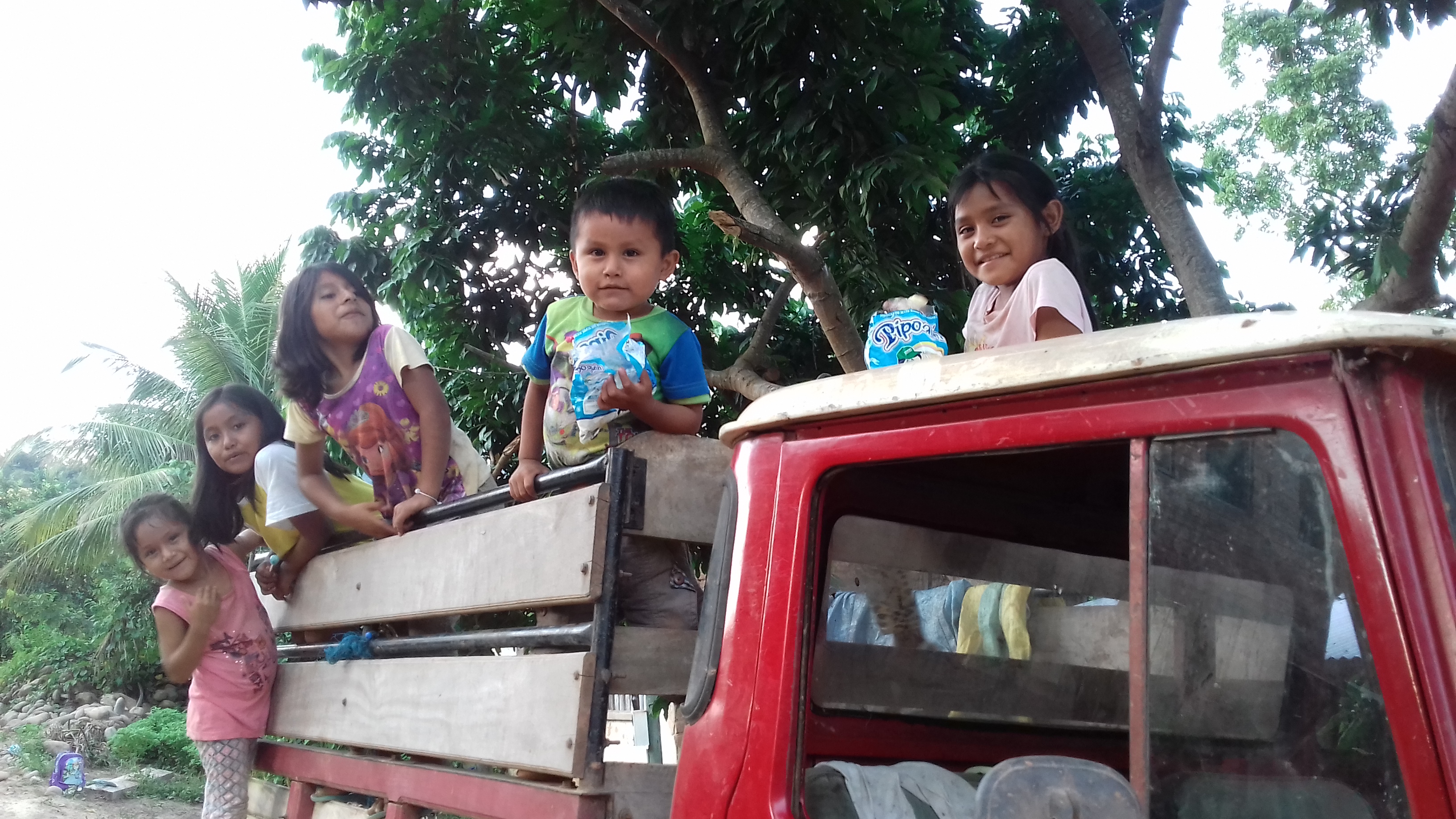 Children in back of truck in Bolivia
