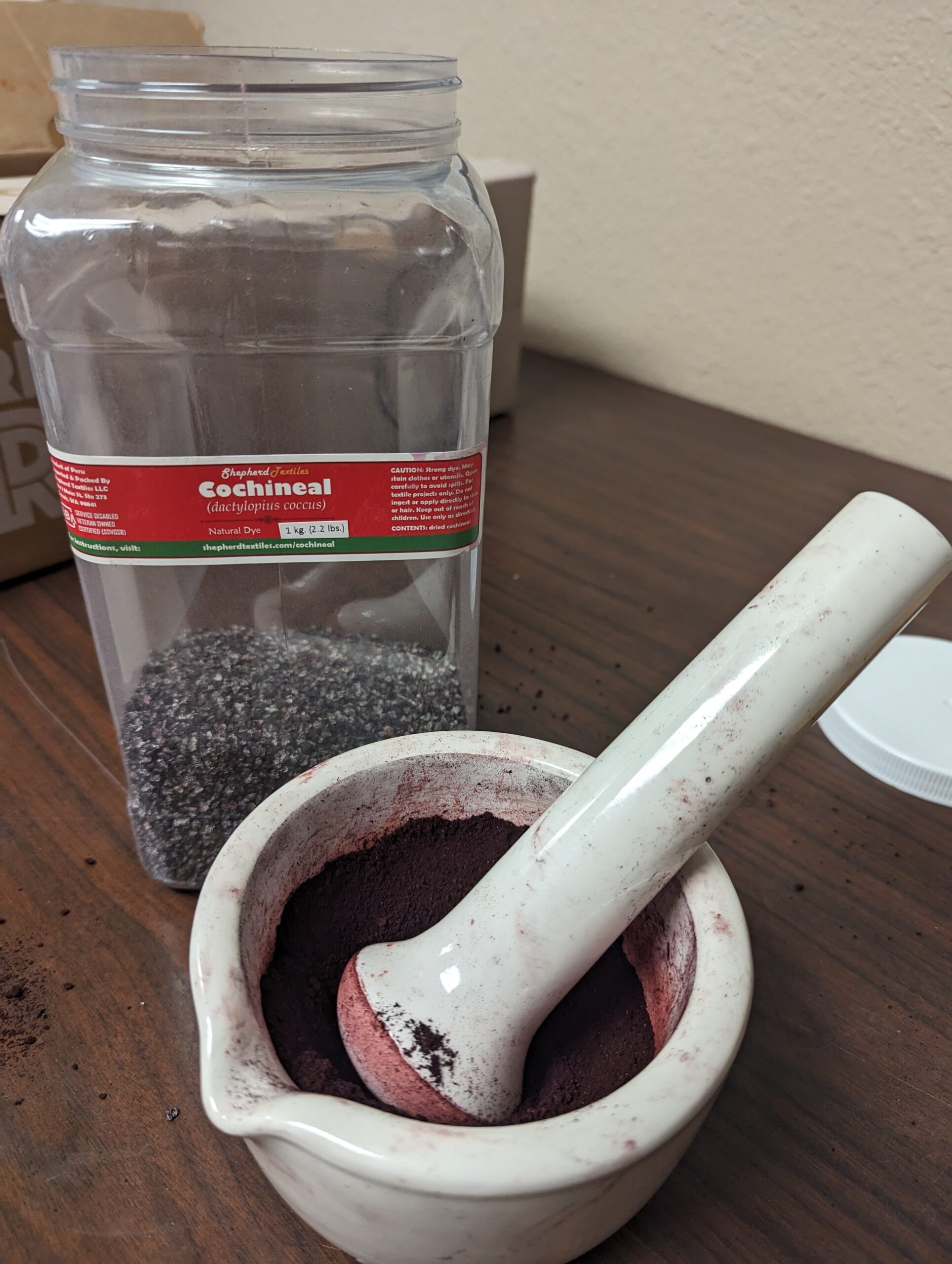 Dehydrated Cochineal Being Ground to a Powder