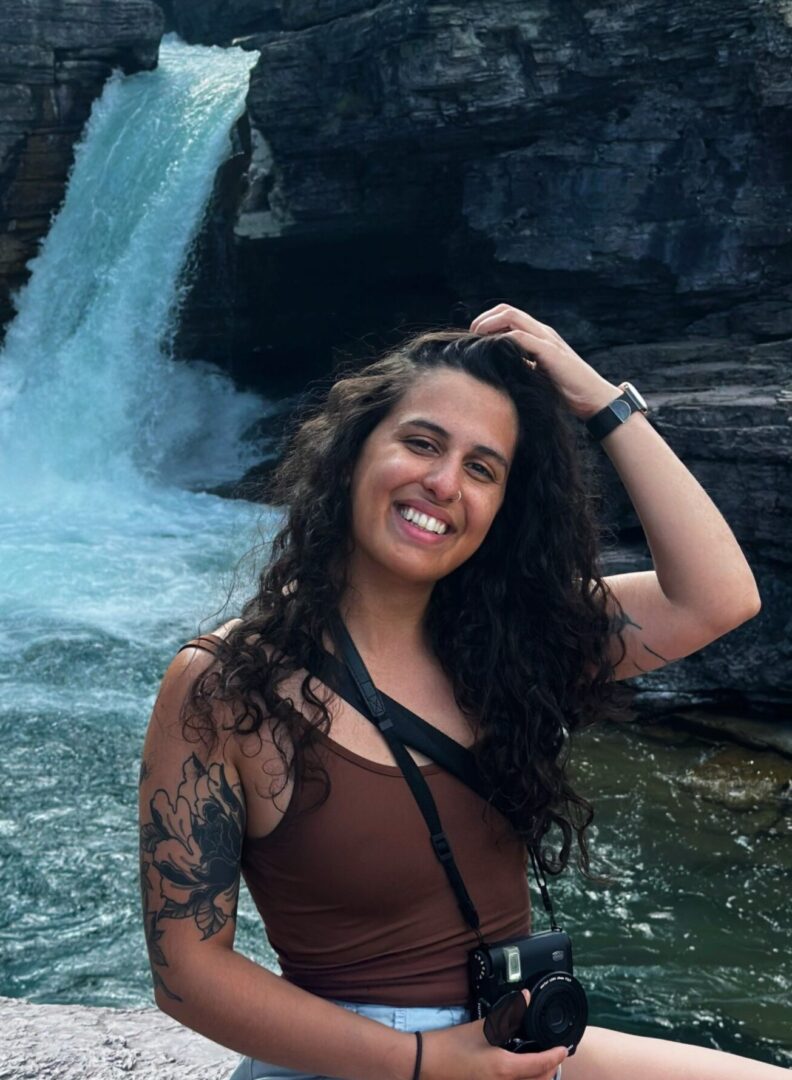 Summer Peltzer in front of waterfall