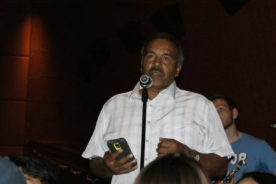 An audience member asks a question to the panel.