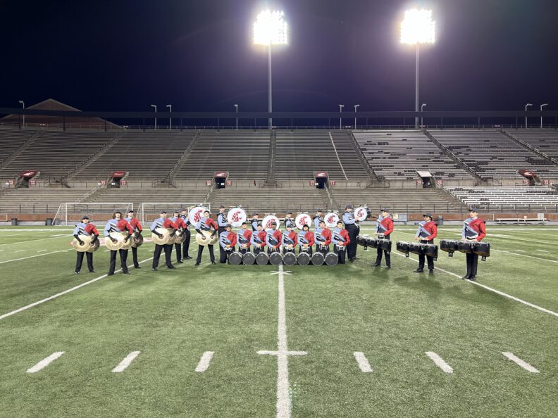 Drumline in formation on field