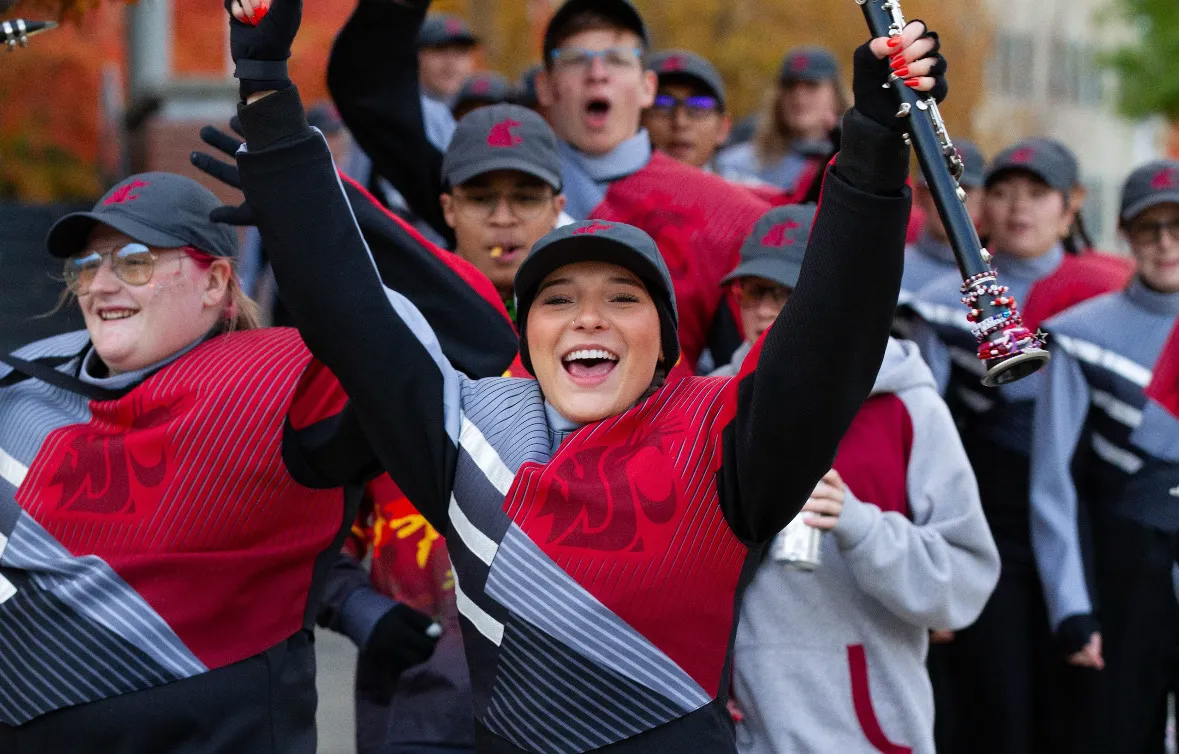 Cougar Marching Band clarinet players cheering