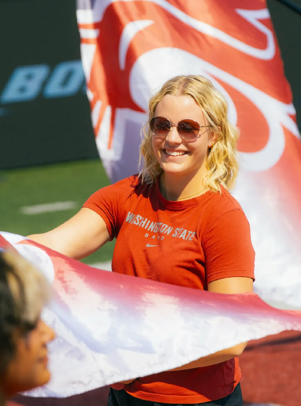Cougar Marching Band color guard member with flag