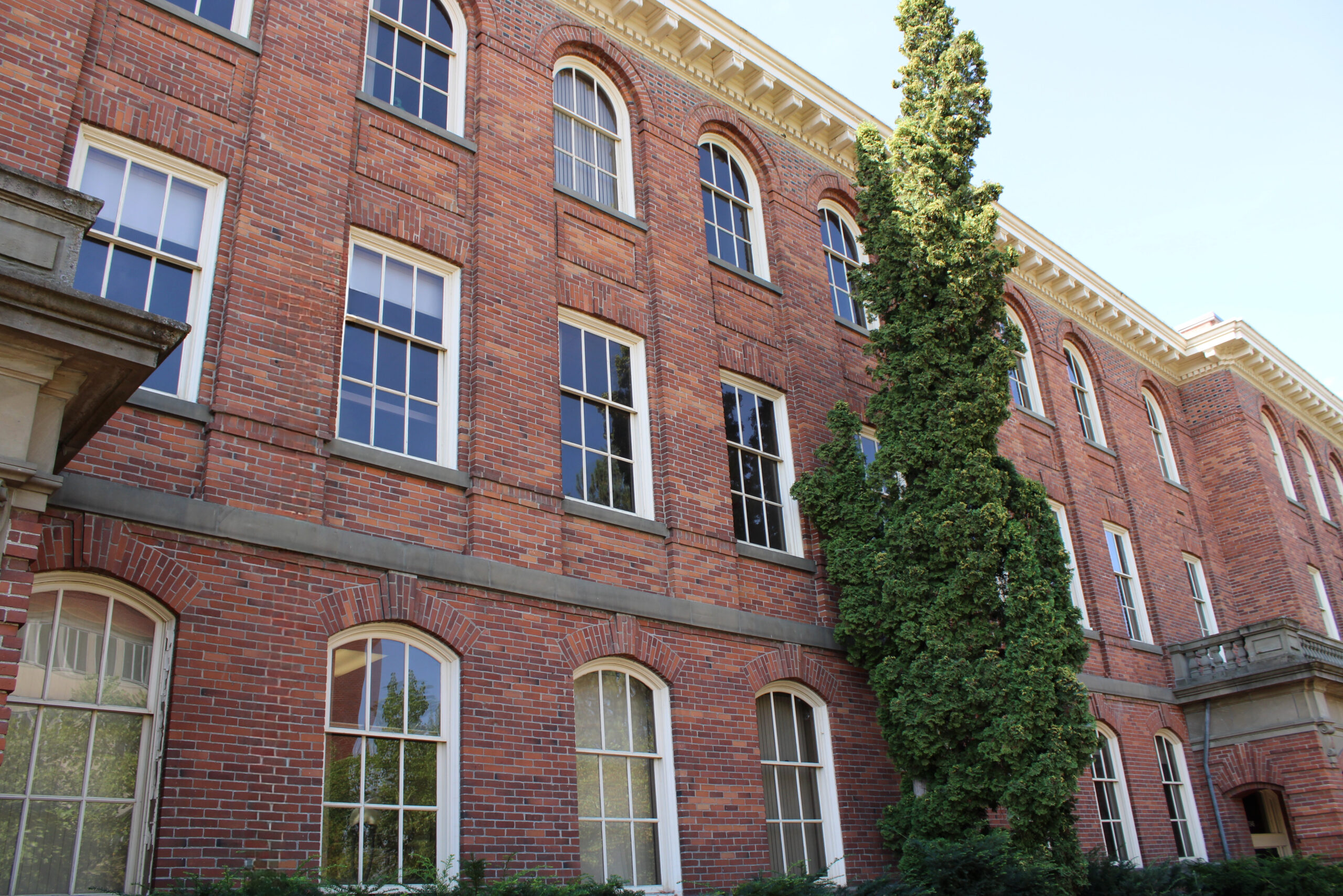Close-up of WSU's College Hall focused on the red bricks and curved windows