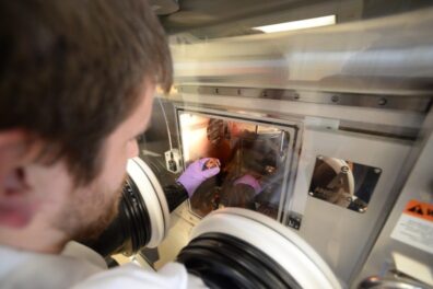 A student works with a vapor deposition chamber