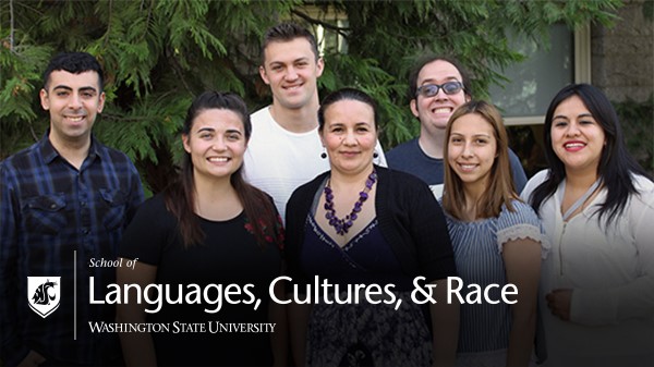 A diverse group of SLCR graduate students smile outside Thompson Hall.
