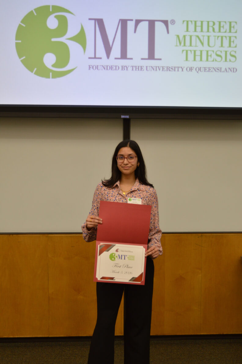 Safiya holds her first place certificate