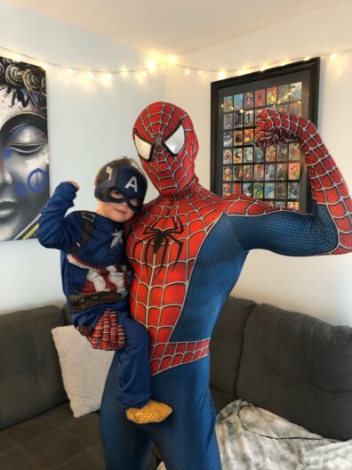 A photo of Joseph Kremer and his son dressed up as superheroes.