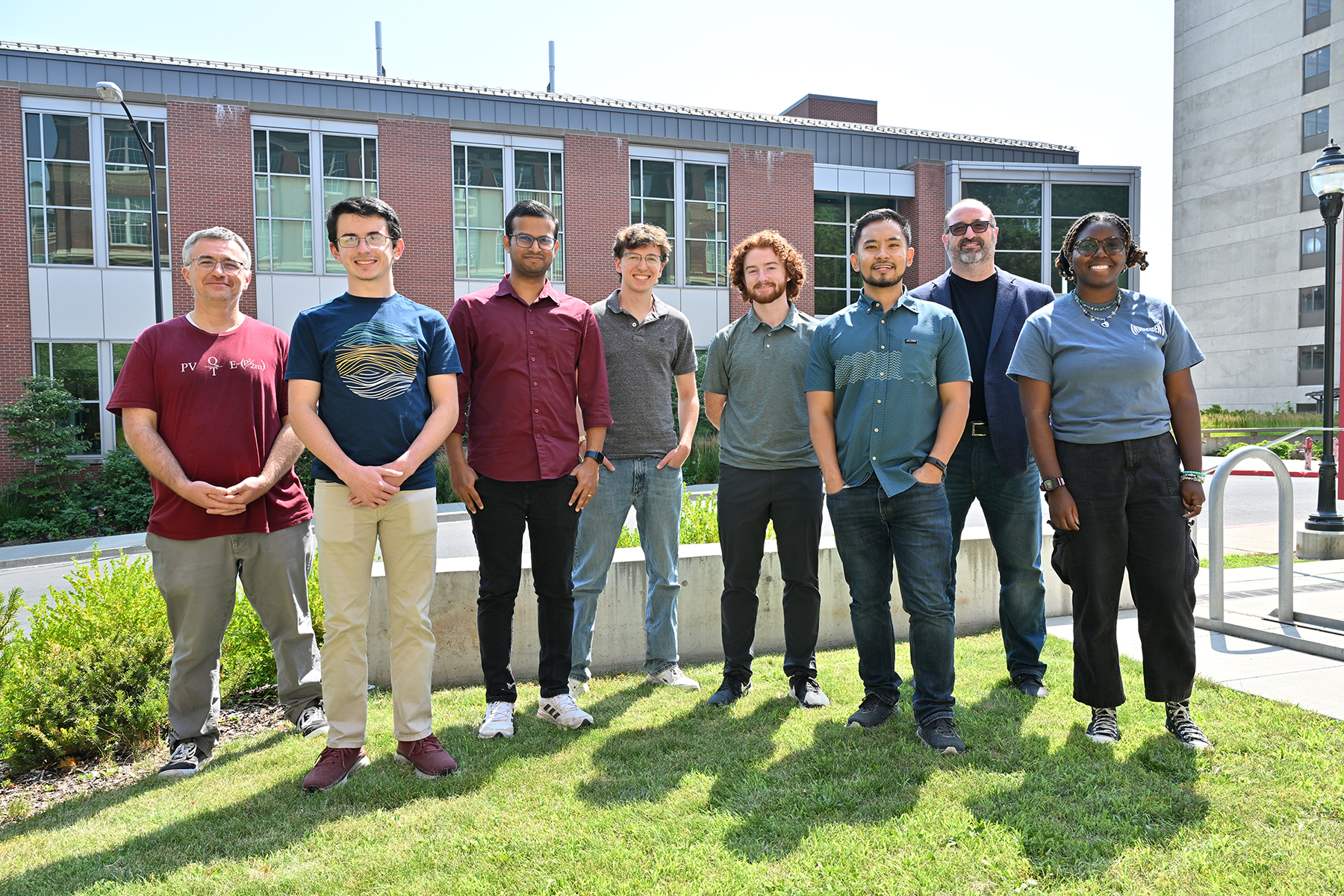 Group of students and instructor in front of ISP building.