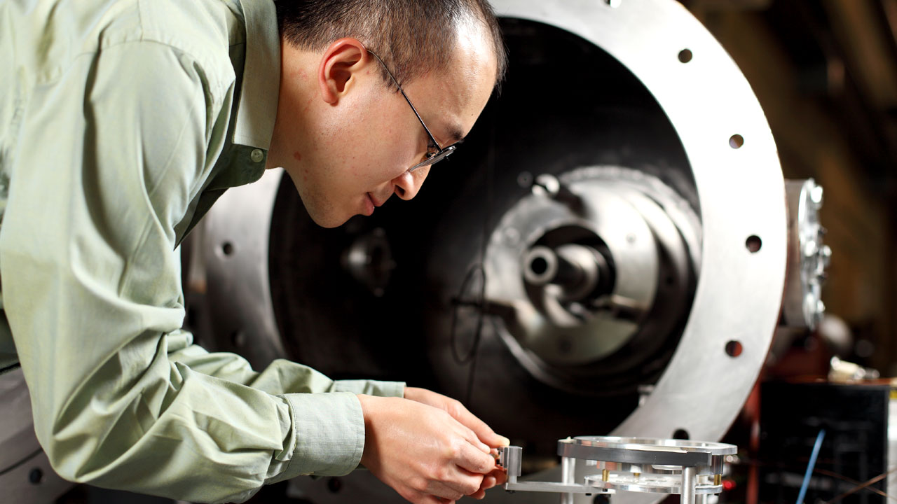 person working on equipment in lab