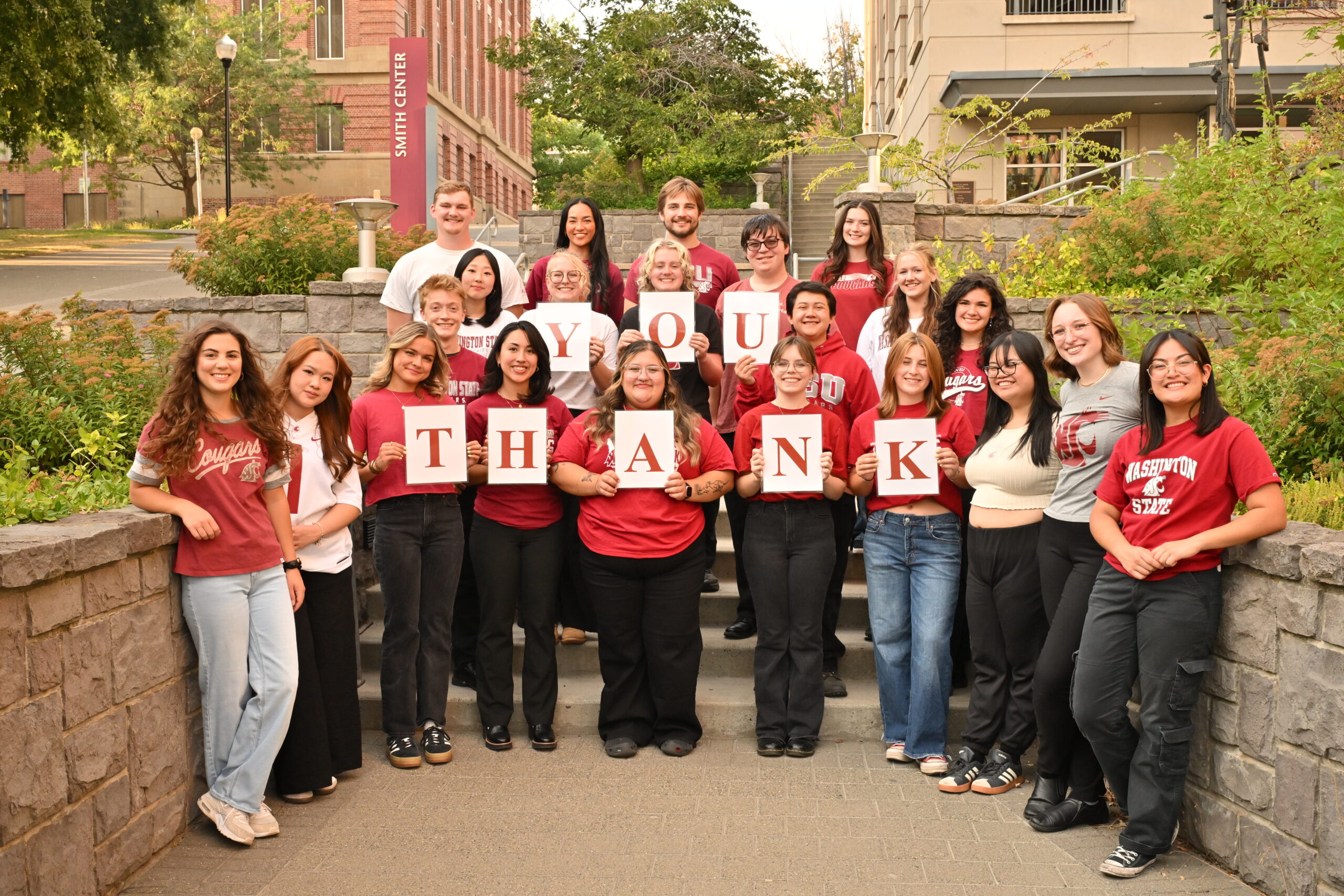 College of Arts and Sciences ambassadors holding cards to spell out "Thank You!"
