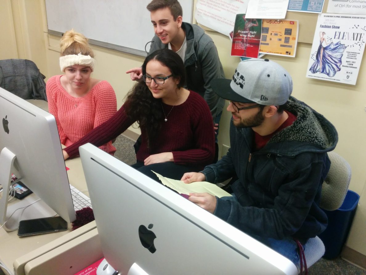 Member of the DTC media club gather in a computer lab.