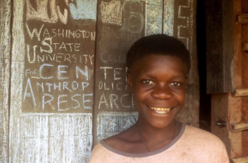 A young boy at the front door of the WSU field station house in the Central African Republic.