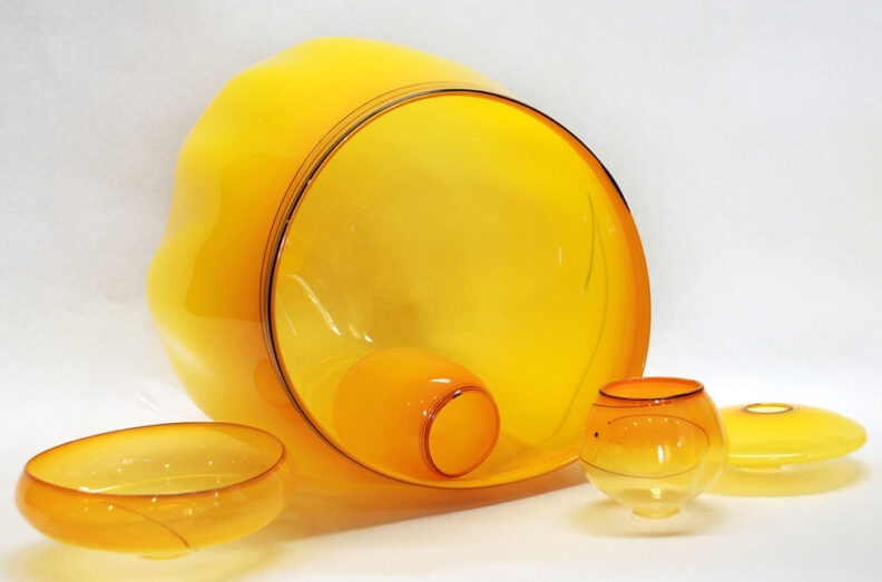 A closeup of a glass-blown basket set.