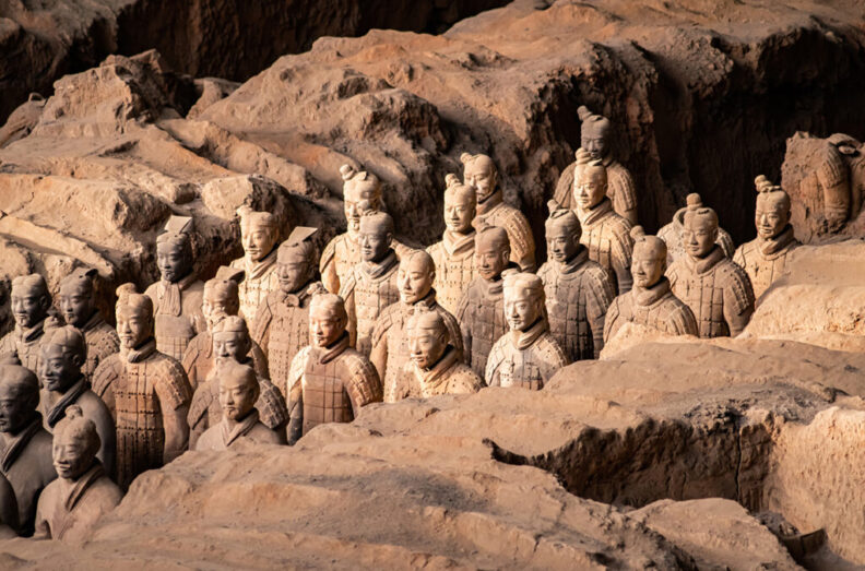The Terracotta Army or the "Terra Cotta Warriors and Horses" buried in the pits next to the Qin Shi Huang's tomb in 210–209 B.C.