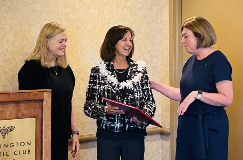Rhoda Altom and Mariah Maki congratulate Linda Pillo after receiving an WSUAA Alumni Achievement award.