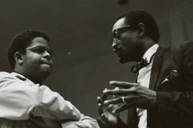 Talmadge Anderson (right) talks with a WSU student in the 1970s.