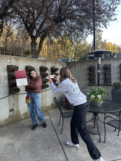 WGSS students taking pictures of their awards.