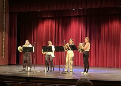 Genghis Barbie performing on stage.