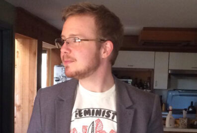 Closeup of Toby Beauchamp in a home.