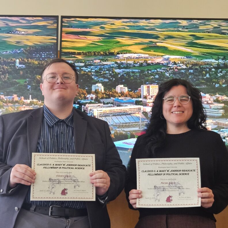 Edward Greer, Marisa Swank holding awards.
