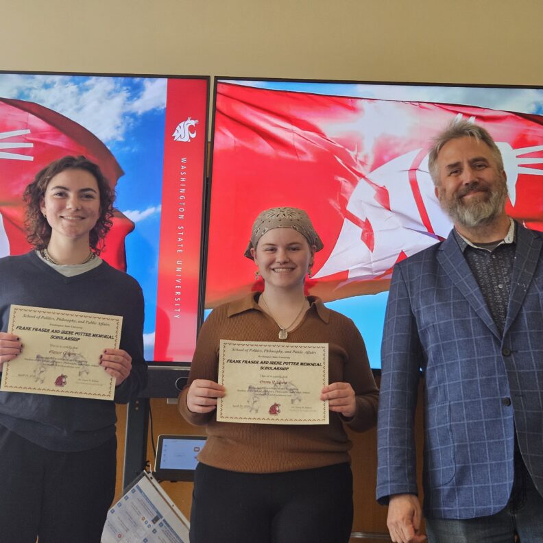 Elenor Colgan, Emma R. Lewis holding awards.
