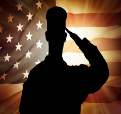 Silhouette of a United States servicemember saluting the US flag.