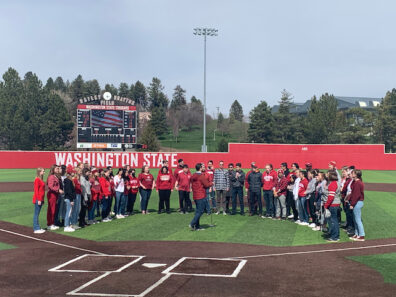 University Singers performing on WSU baseball diamond.