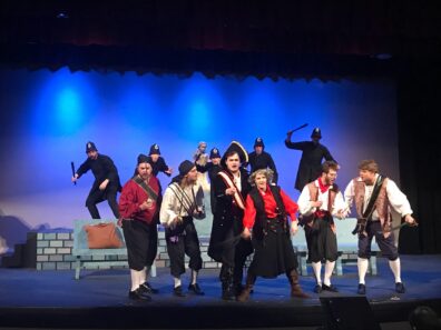 Pirates singing on stage