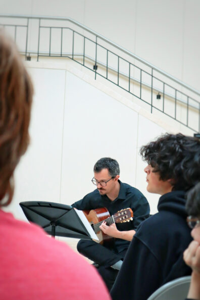 Guitarist performing in Atrium.