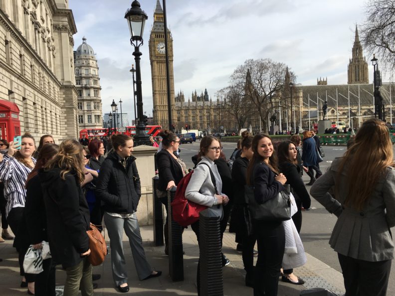 A group standing outside, Big Ben is visible in the background.