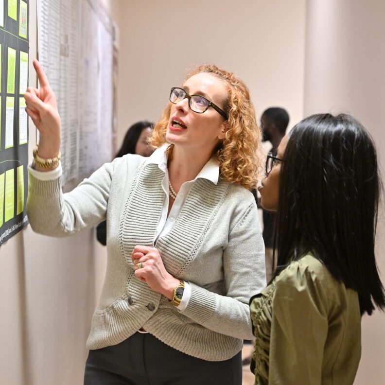 Melanie-Angela Neuilly with student.