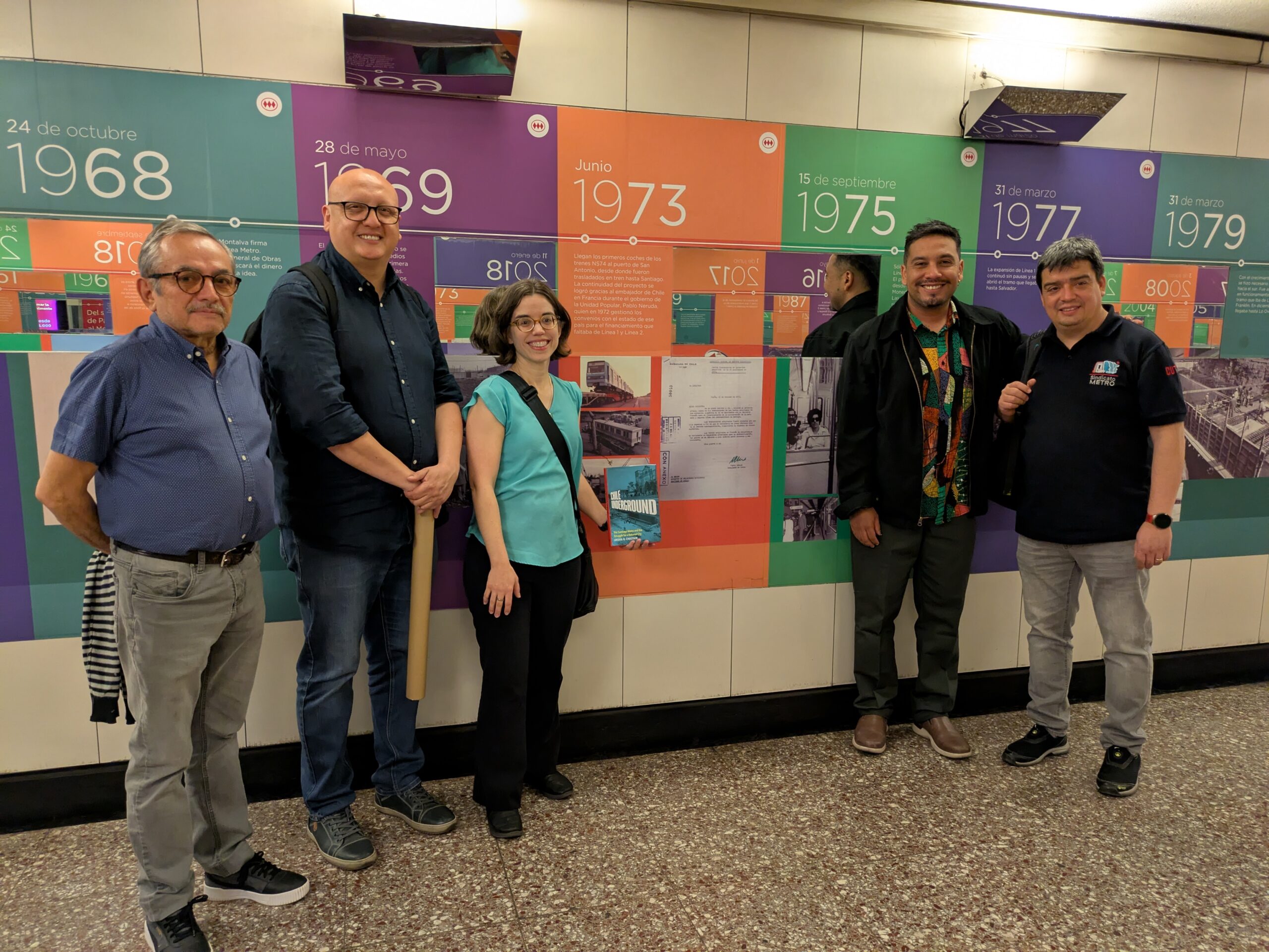 A group of people in front of a display